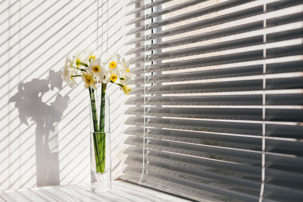 decorative-flowers-vase near window blinds